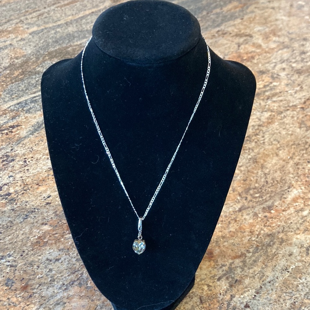 Clear gray crystal heart shaped pendant set in gunmetal grey setting